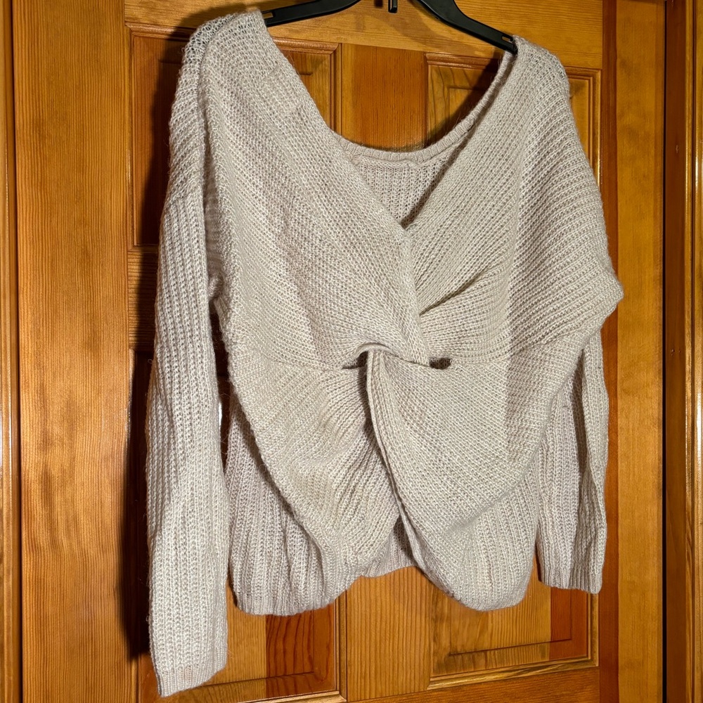 Oatmeal cream sweater with a lovely knot in the back